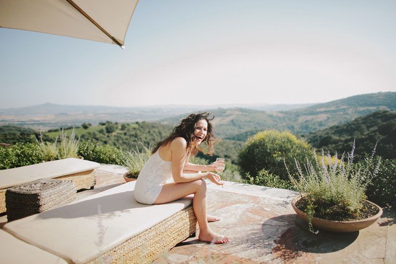 A relaxed moment captured on a terrace with scenic mountain views in the background.