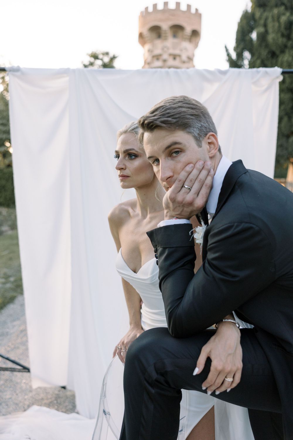 Artistic wedding portraits against white backdrop showing intimate moments between couple.