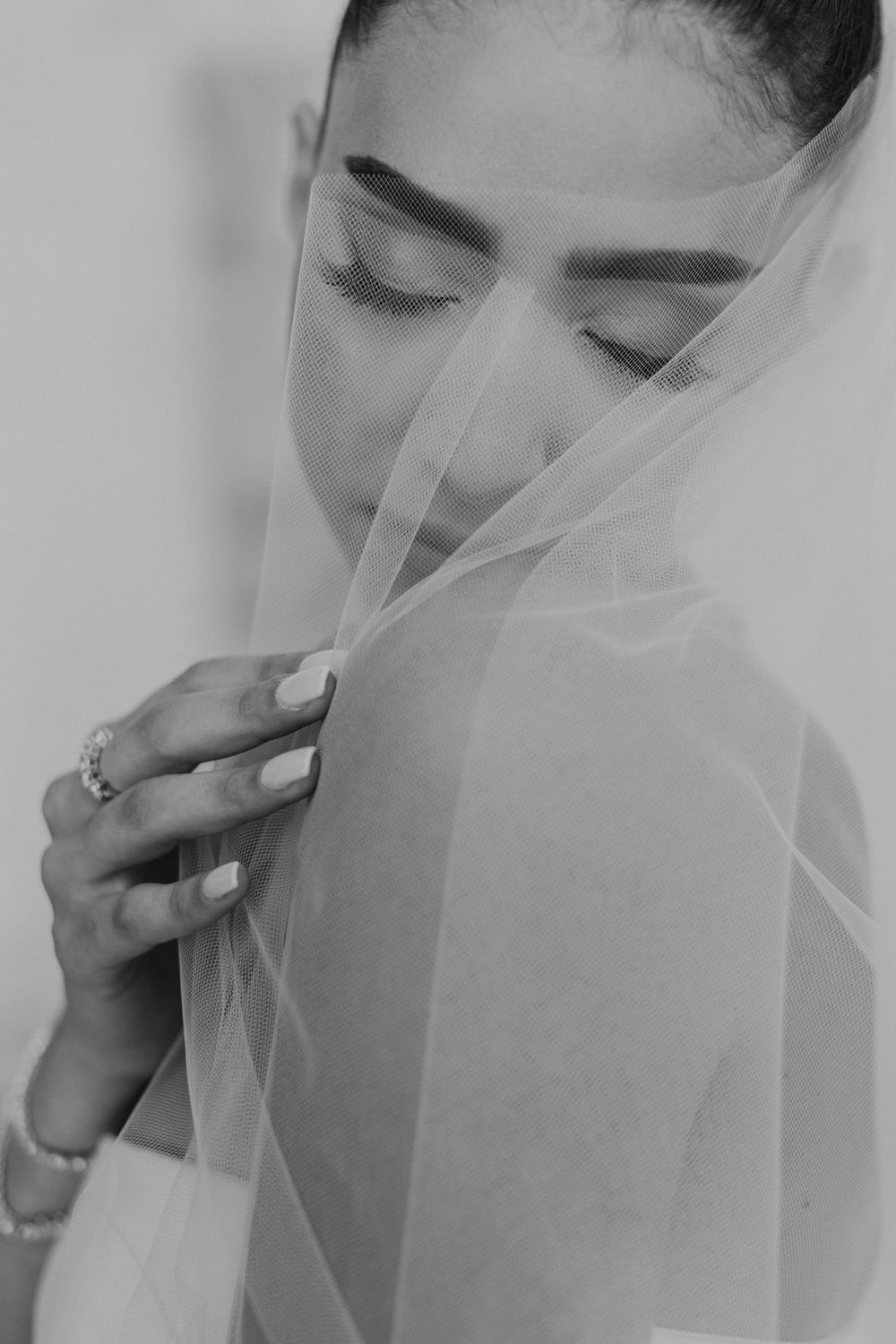 Black and white close-up sequence showing delicate bridal veil details.