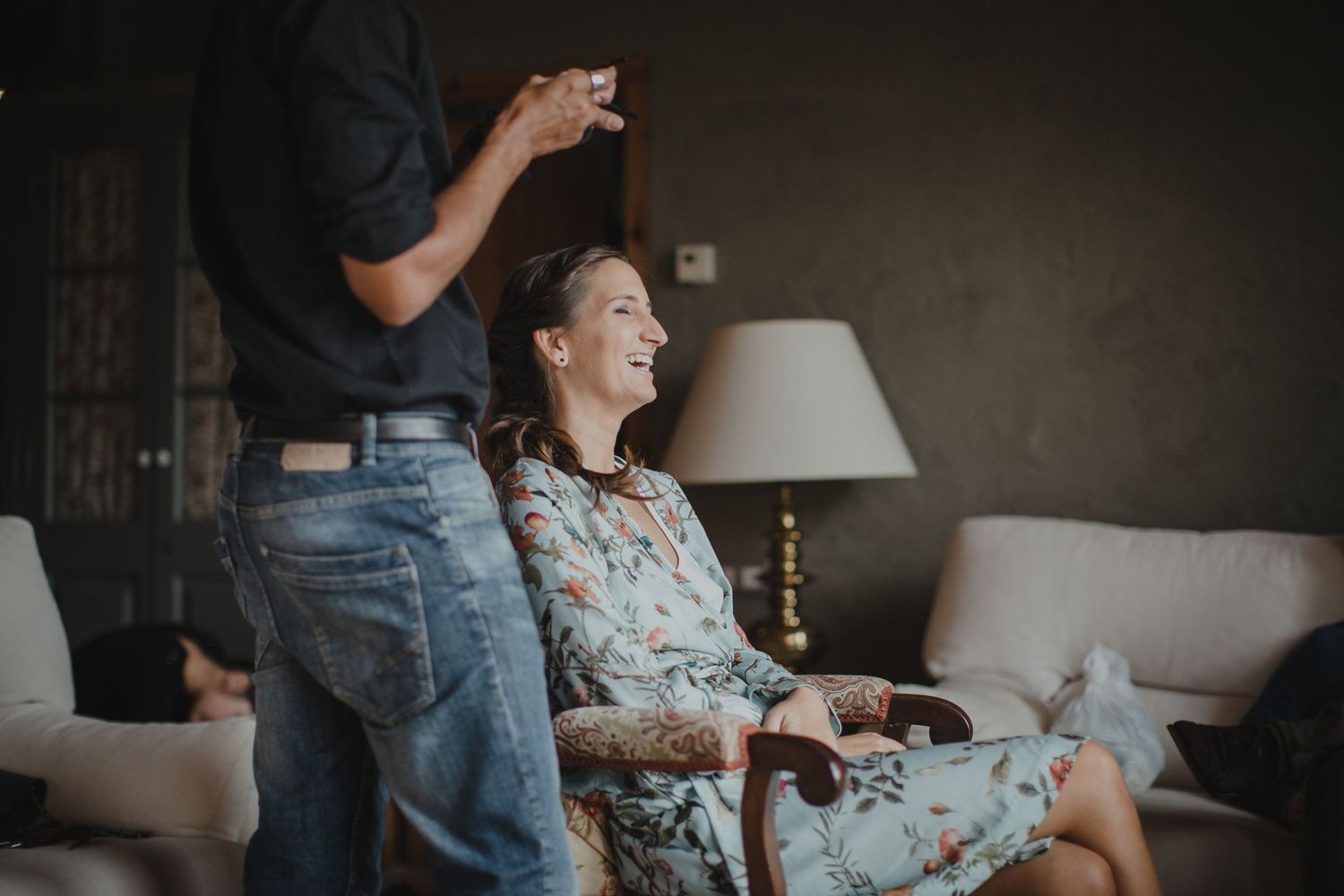 Joyful moment captured in a cozy living room with warm lighting and casual atmosphere.