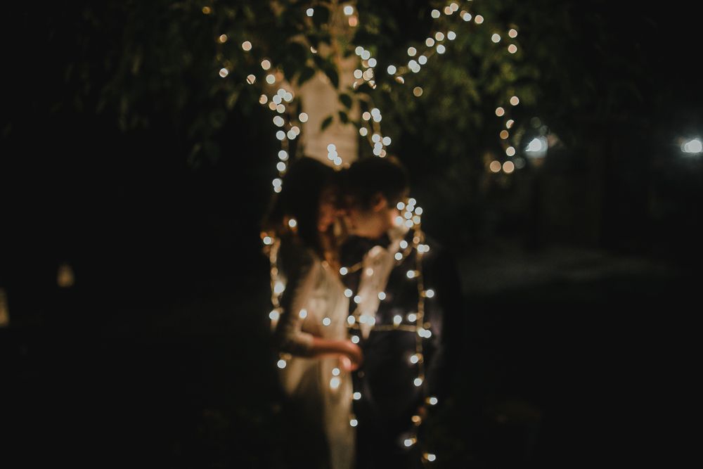 Dreamy bokeh lights creating magical atmosphere at outdoor nighttime celebration.