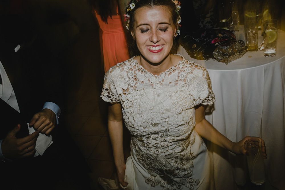A candid moment of dancing and celebration at a wedding reception.