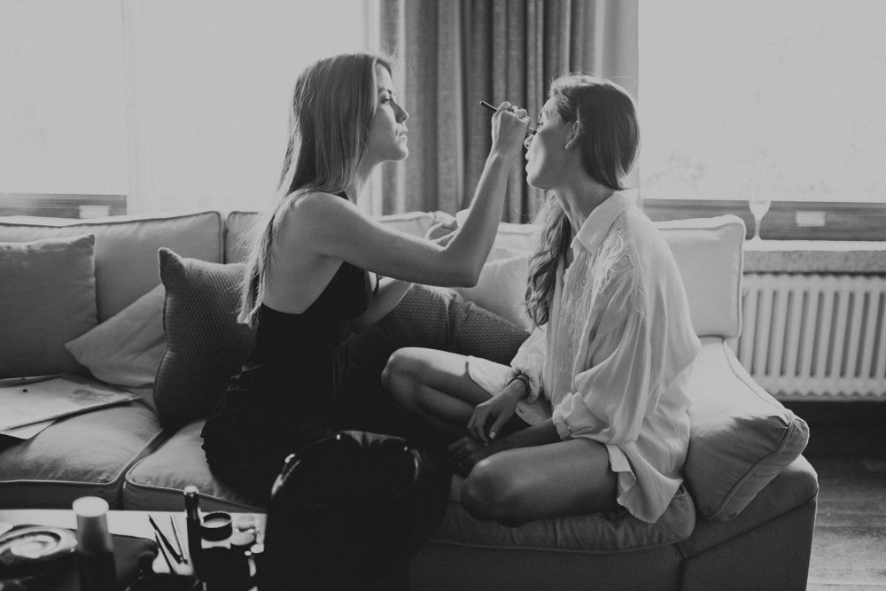 Two people sharing an intimate moment on a cozy sofa.