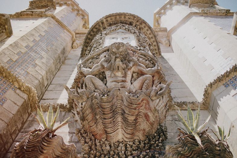 Ornate architectural detail of a stone facade with elaborate carvings and decorative elements.