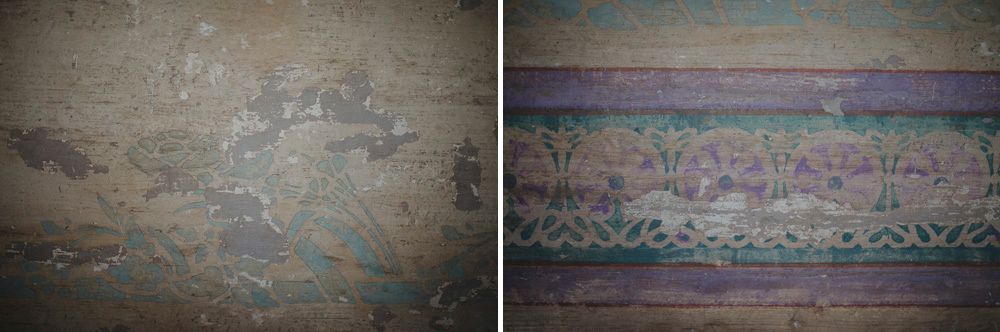 Vintage wall texture with faded paint and decorative border details.