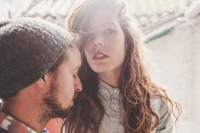 Close up profile shot of two people in natural lighting.