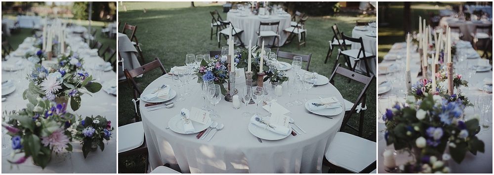 Wedding reception tables set with elegant white linens and floral centerpieces.
