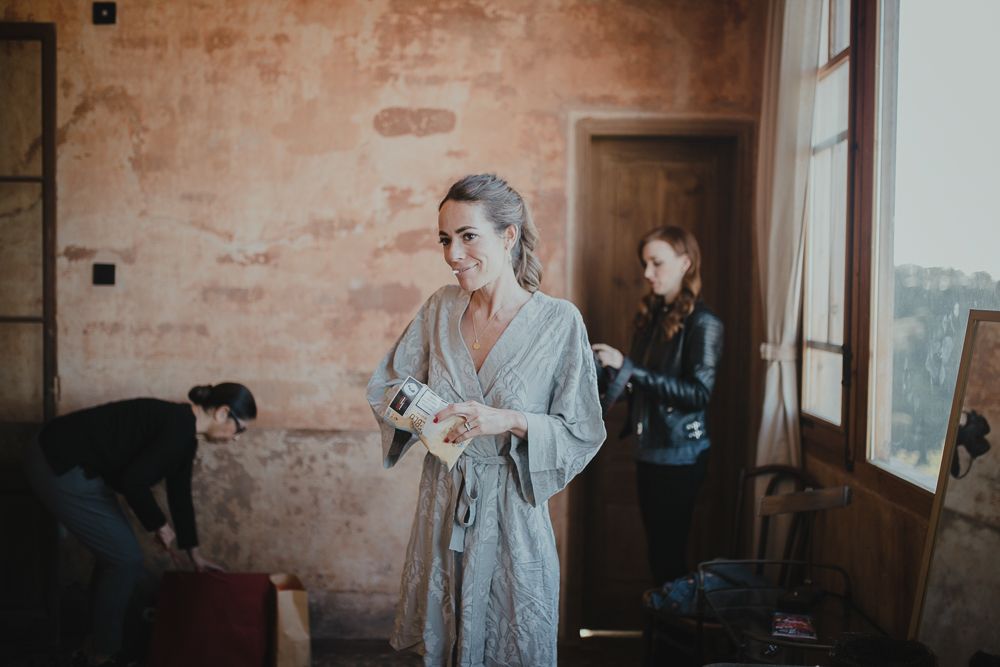 Getting ready scene in rustic room with vintage peach walls.