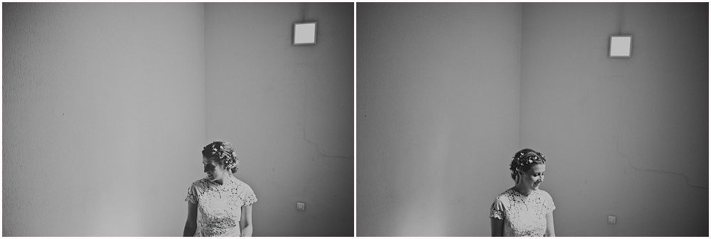 Minimalist black and white bridal portraits against plain wall showing elegant dress details.