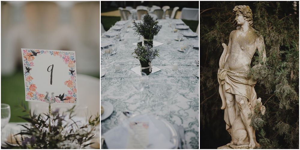 Wedding reception details including table number, place settings, and garden statue decor.