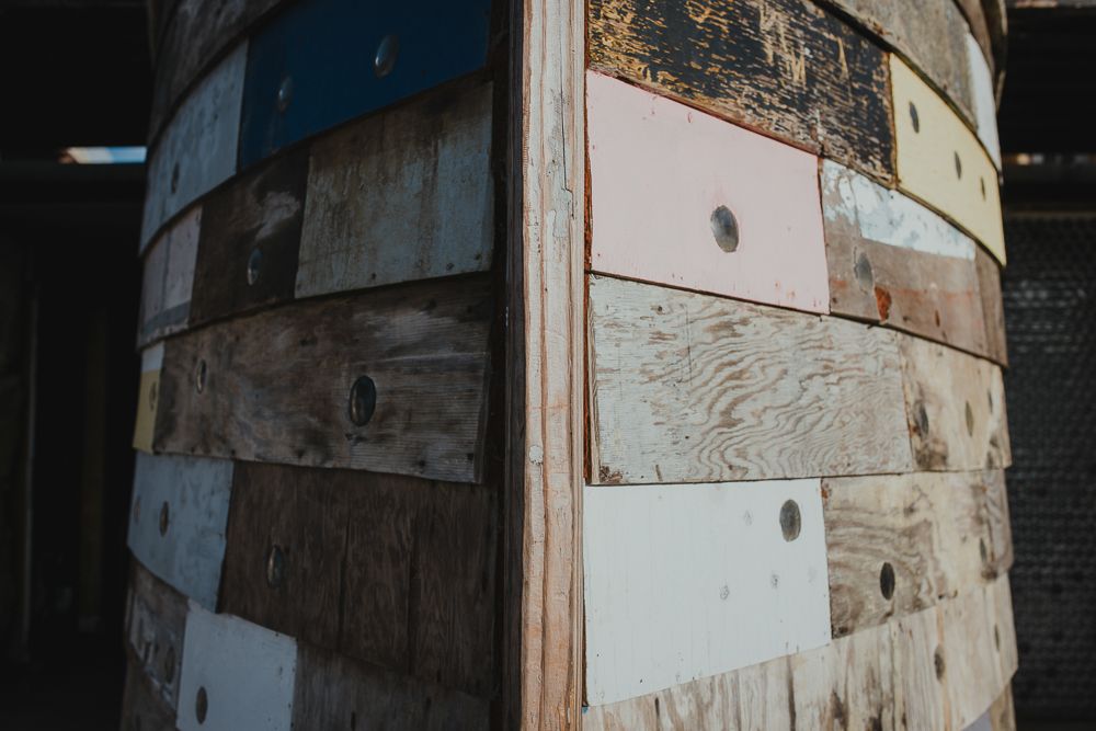 Close-up of weathered wooden panels in various shades and textures.