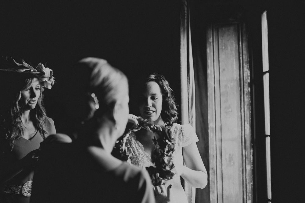 Dramatic black and white photo of preparation scene with vintage aesthetic.