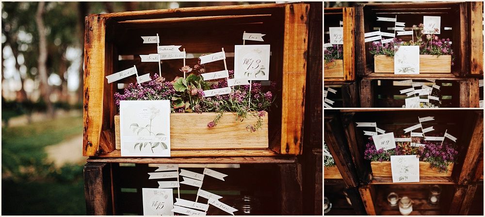 Vintage wooden display frame with wedding photos and decorative elements.