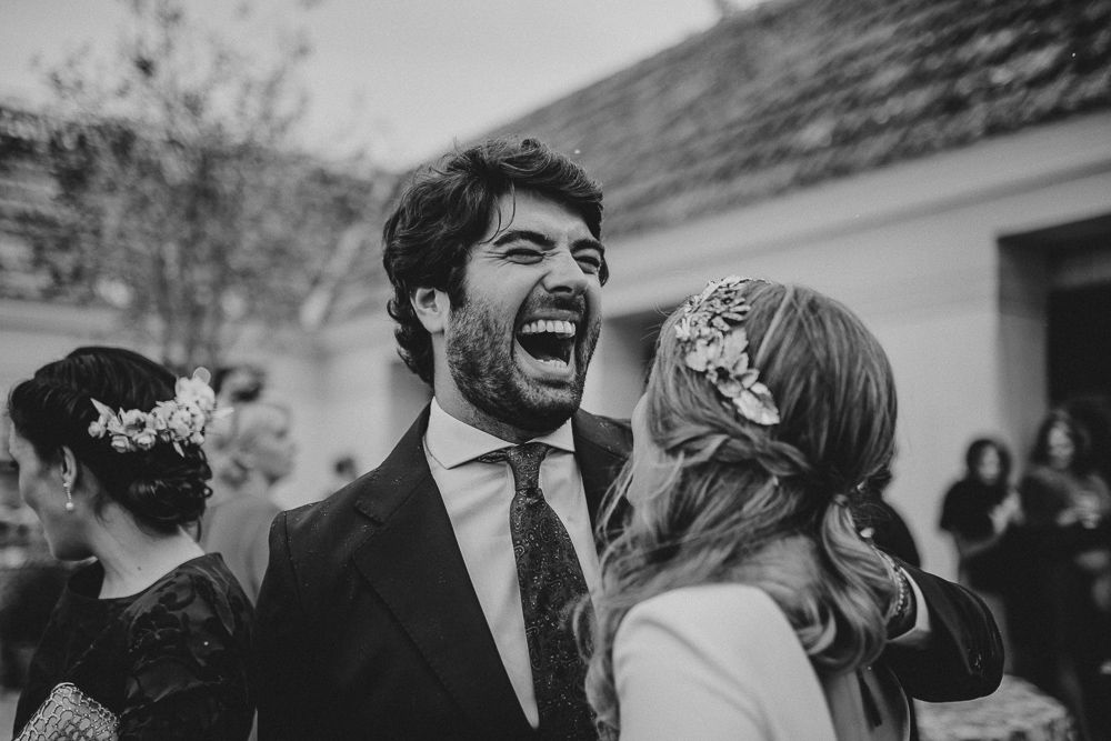 A joyful moment captured at an outdoor wedding celebration.