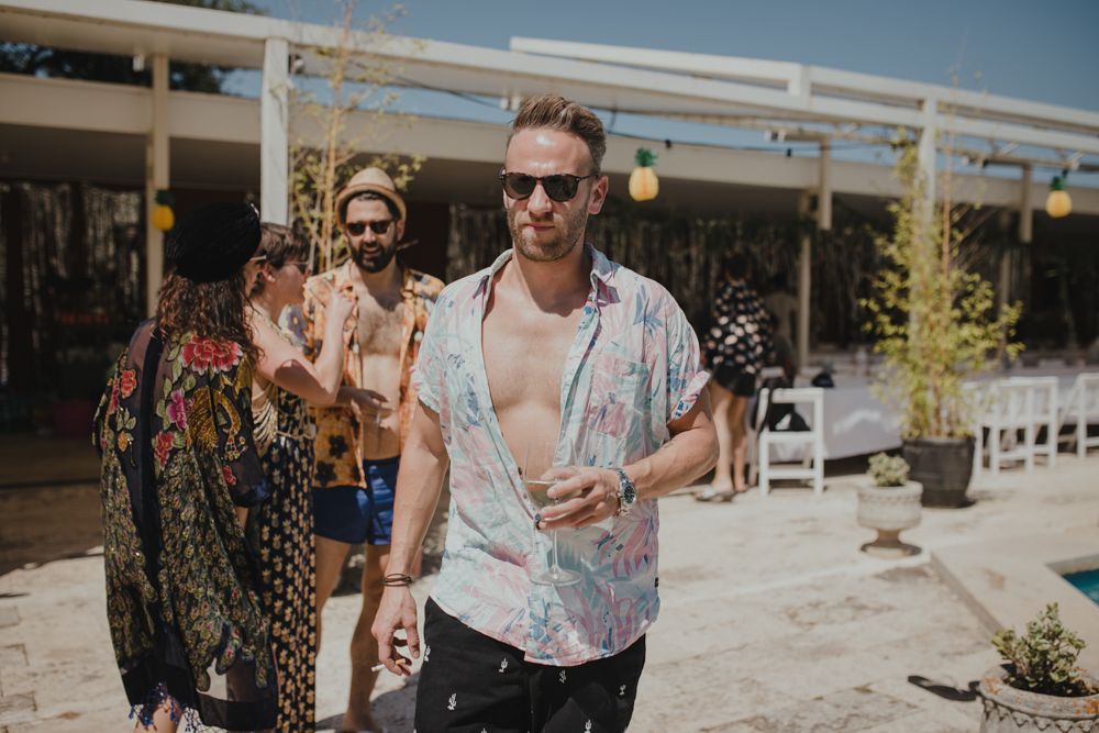 People enjoying a casual summer pool party outdoors.