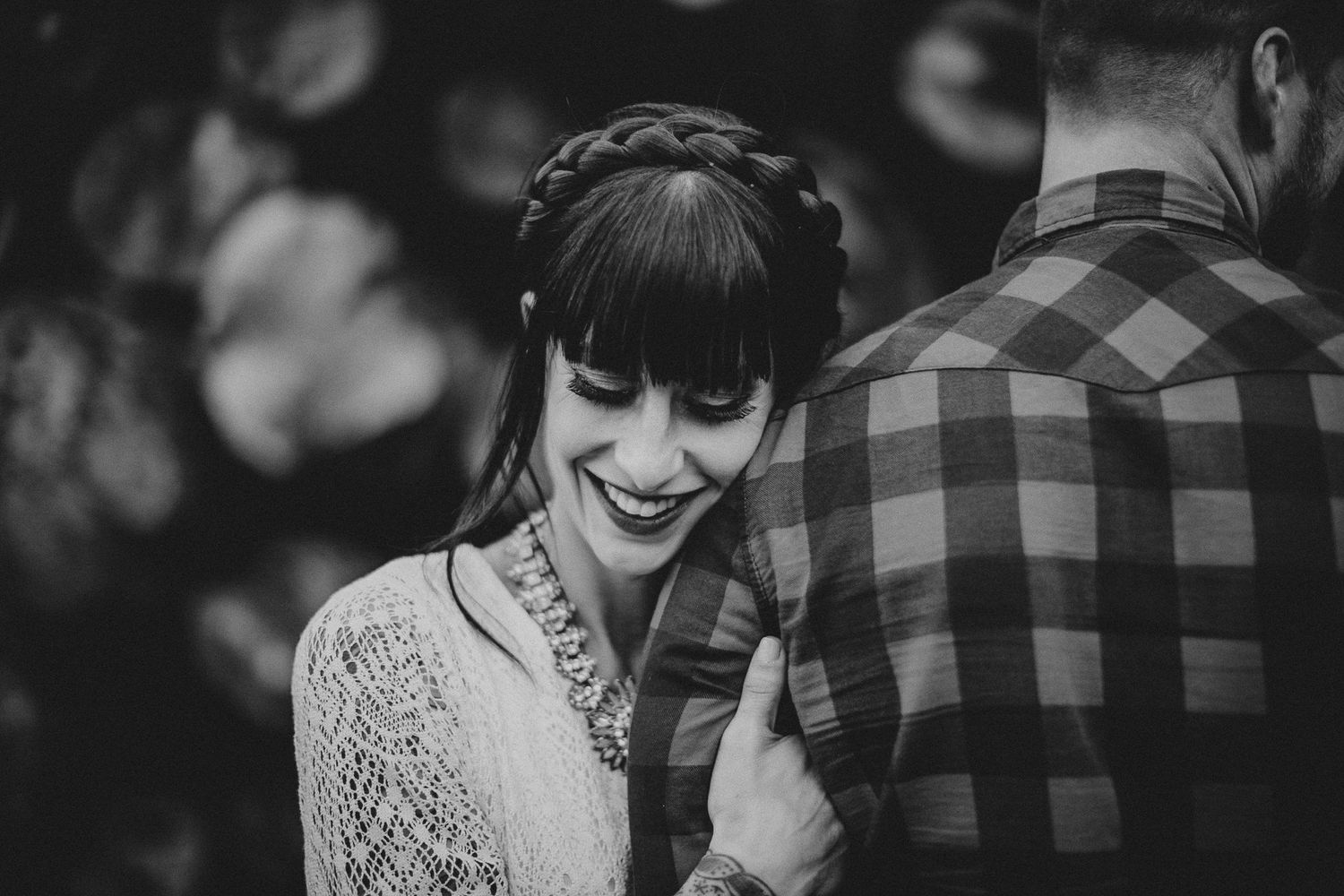 Joyful black and white portrait showing genuine laughter and emotion.