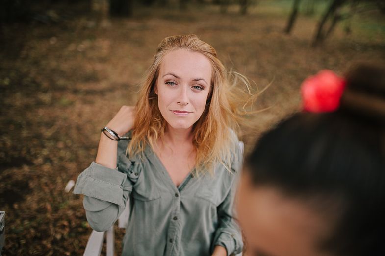 Casual outdoor portrait session with soft natural lighting and autumn background.