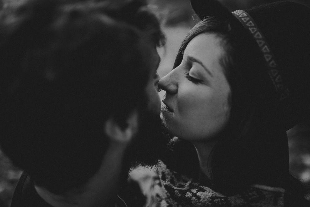 Intimate black and white portrait of a romantic moment between two people.