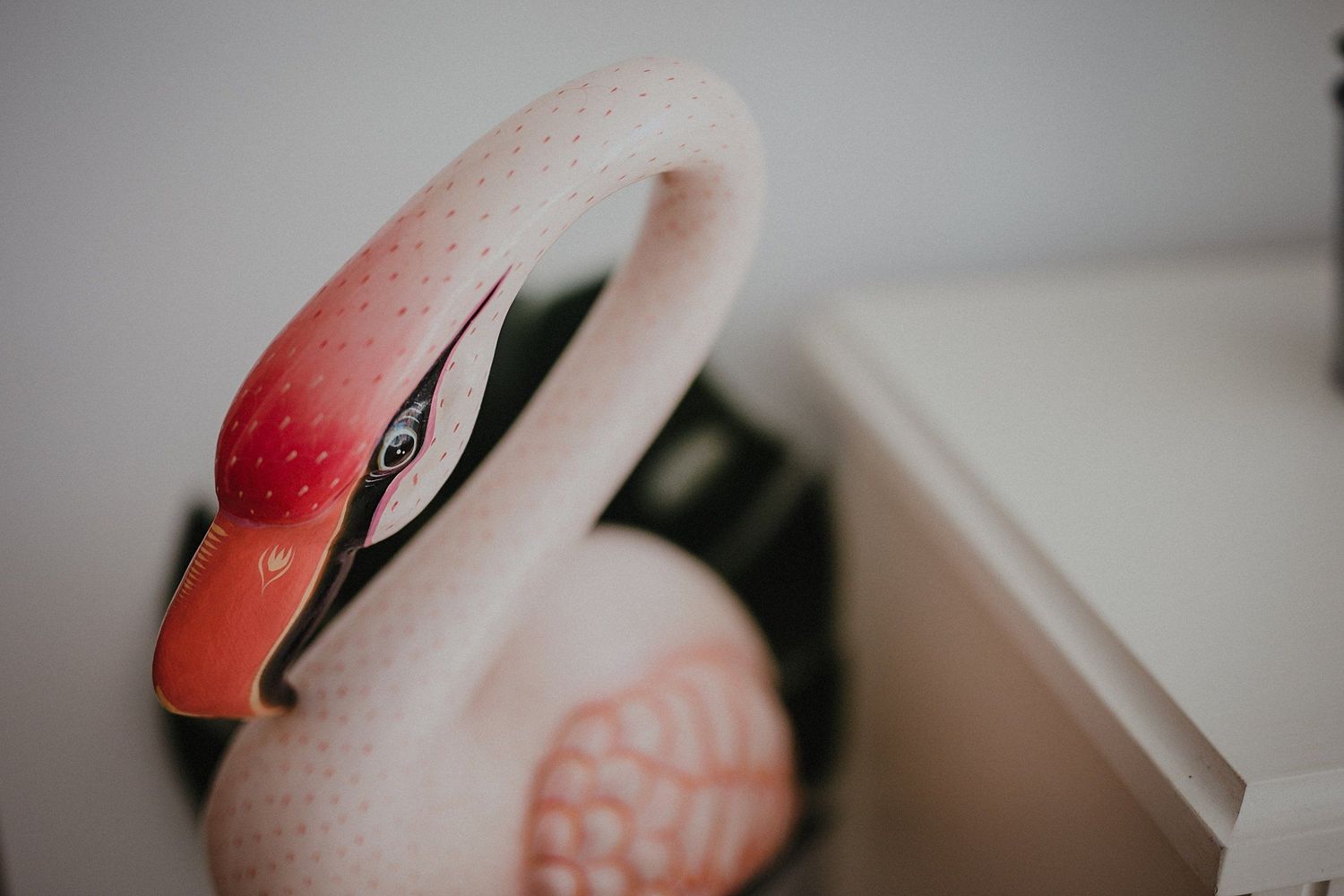 Close-up detail of decorative pink flamingo ornament.