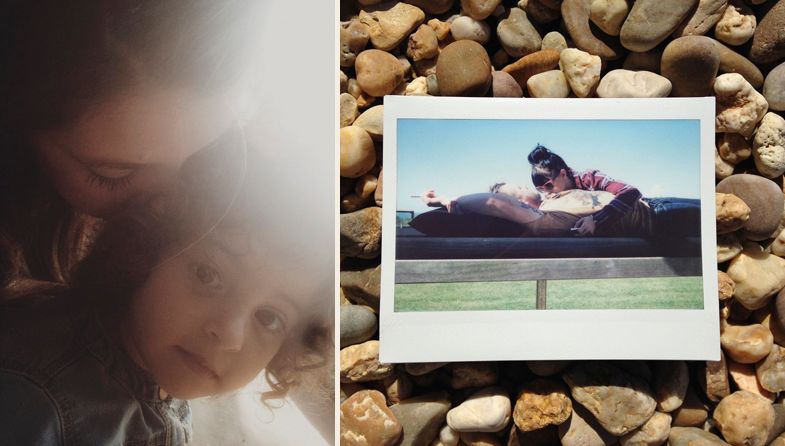 A polaroid photo of a jumping figure displayed on stones next to a dark portrait.