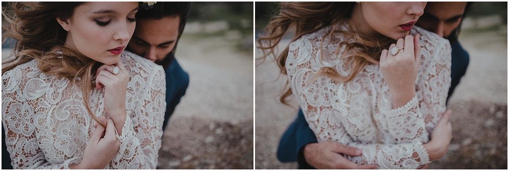 Romantic couple embrace in vintage-inspired lace wedding attire.