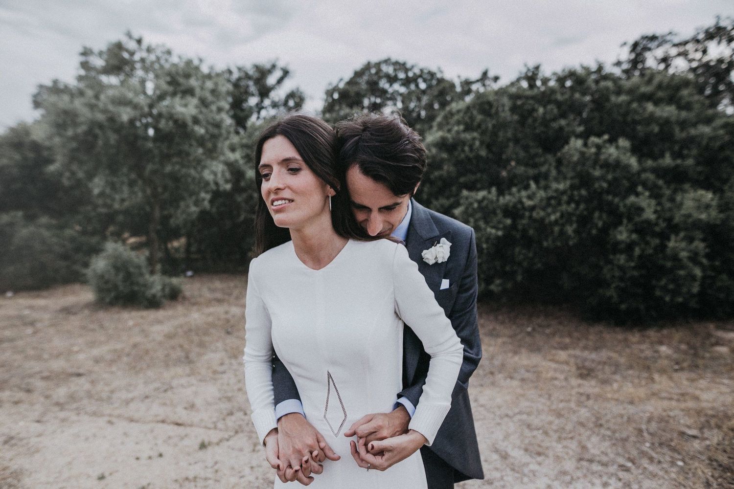 An intimate wedding portrait showing a tender moment between newlyweds.