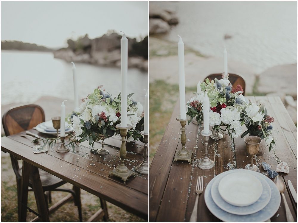 Elegant outdoor table decor with white flowers and vintage glassware on wooden tables.