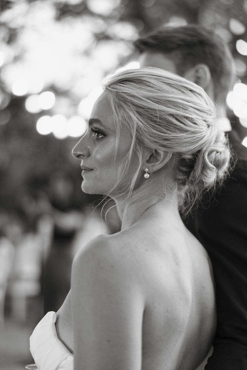 Artistic black and white profile portraits showing elegant hairstyling and jewelry.