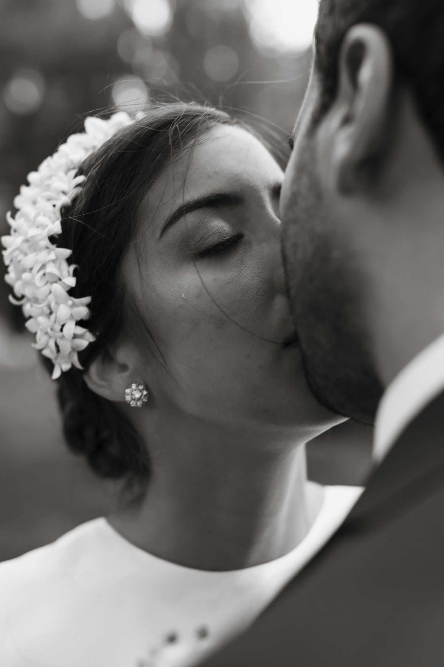 Intimate black and white wedding portrait captured in romantic close-up.