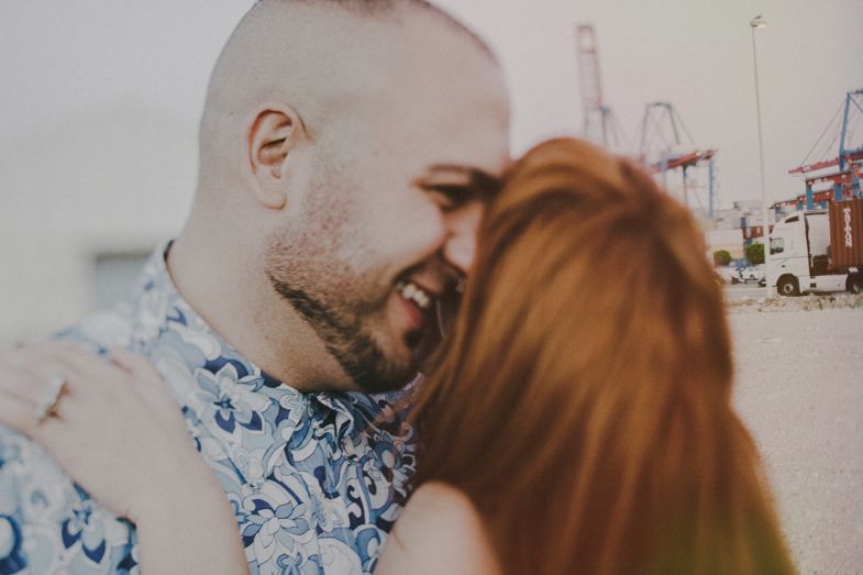 An intimate close-up moment captured between a couple on a sunny day.