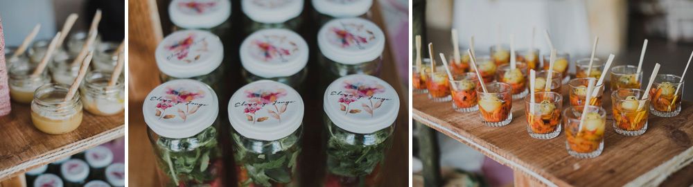 Wedding reception food displays with mason jars and appetizer bites.