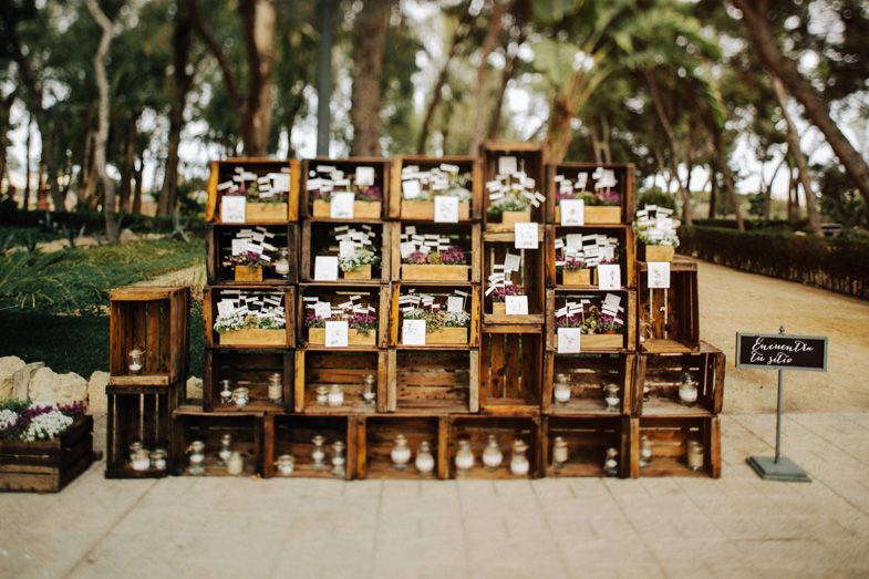Rustic wooden crate display with multiple compartments arranged as wedding decor.