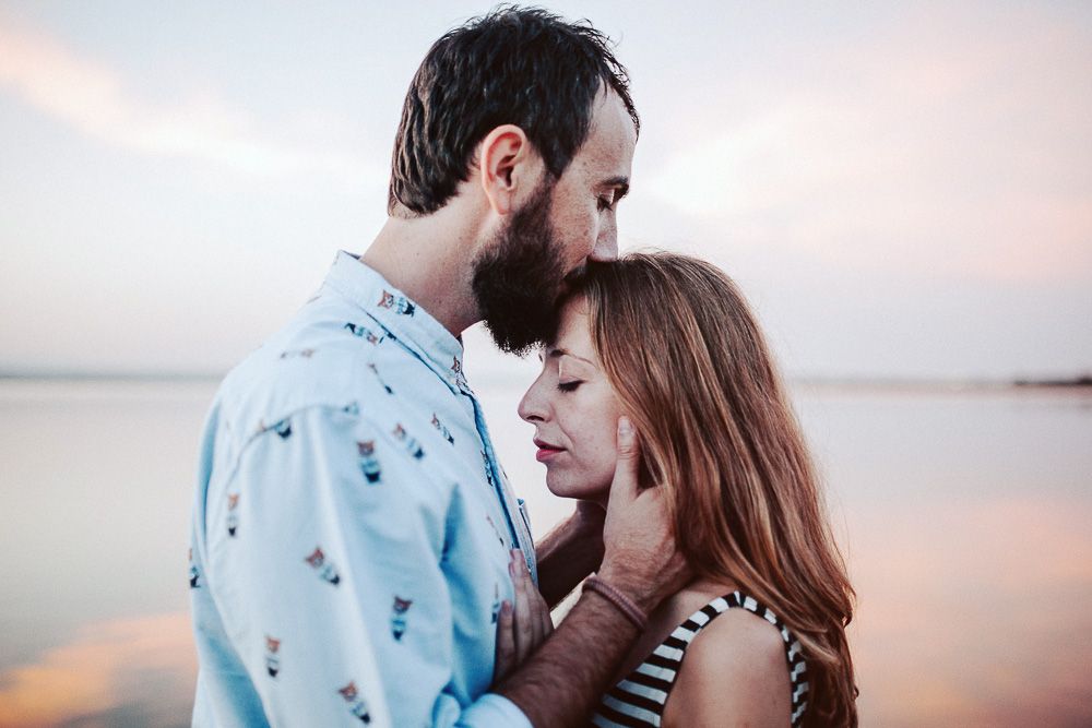 An intimate moment captured between a couple during golden hour.