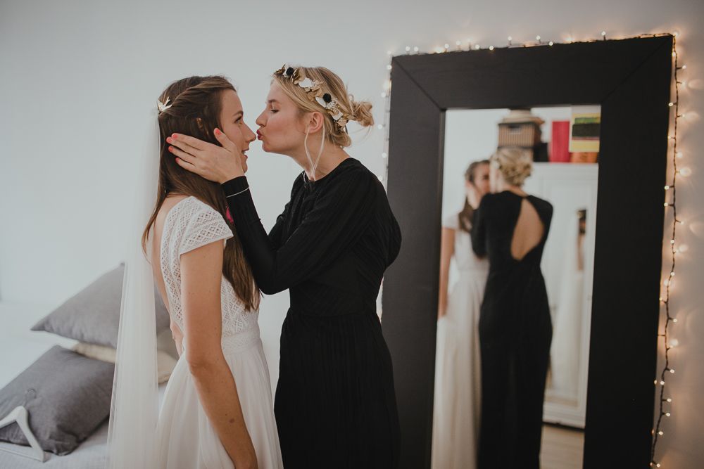 An intimate pre-wedding moment captured with a mirror reflection and fairy lights.