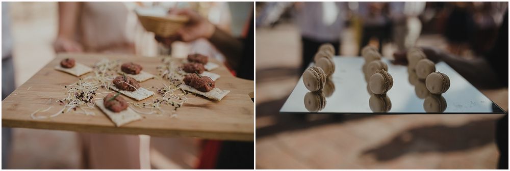Wedding dessert display featuring artisanal chocolates and sweets on wooden surfaces.