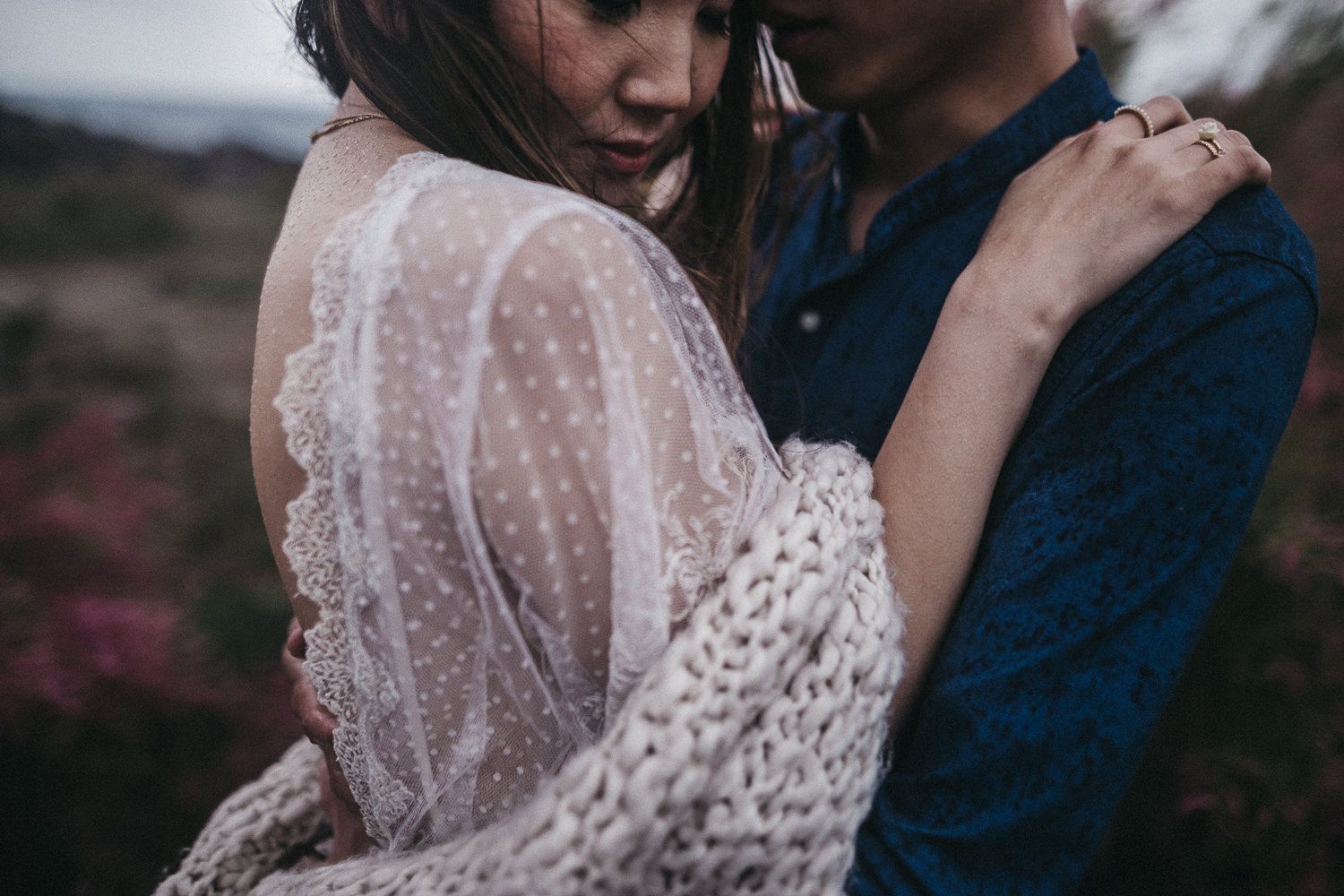 Intimate couple portrait featuring delicate lace dress details.