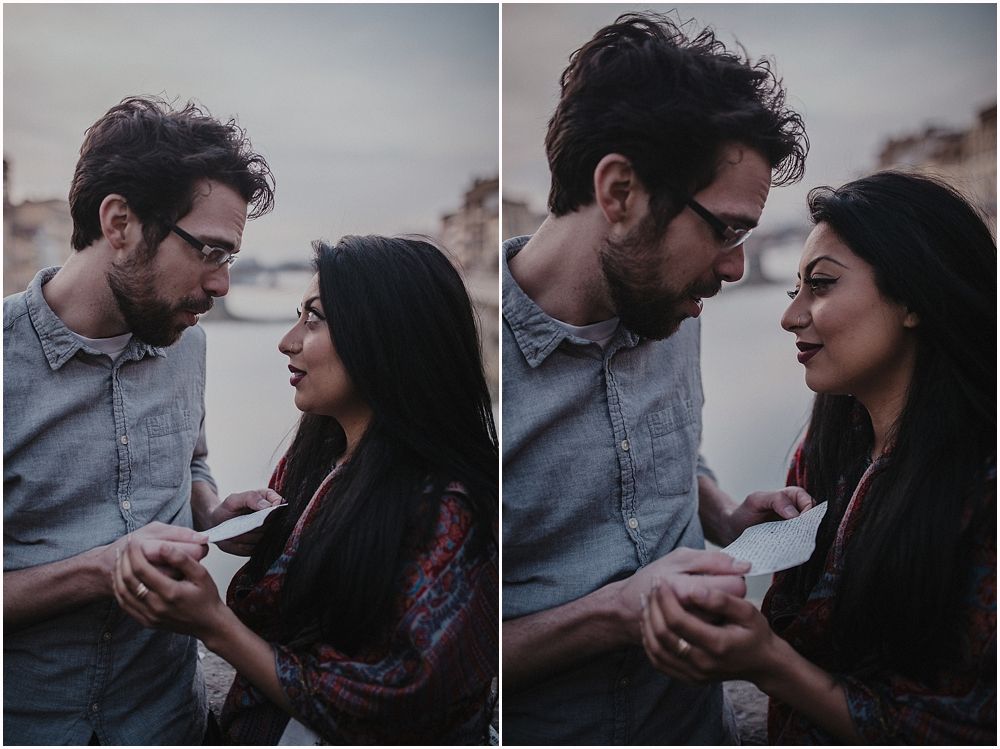 A romantic couple shares an intimate moment against the backdrop of Florence's historic architecture.
