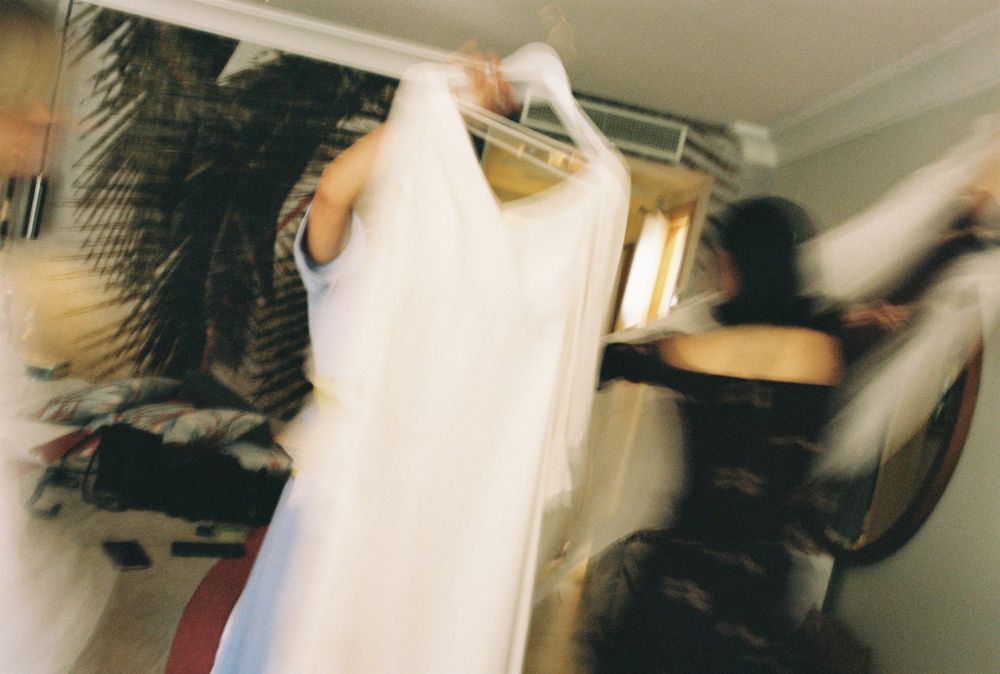 Motion-blurred images capturing the energy of wedding preparations.