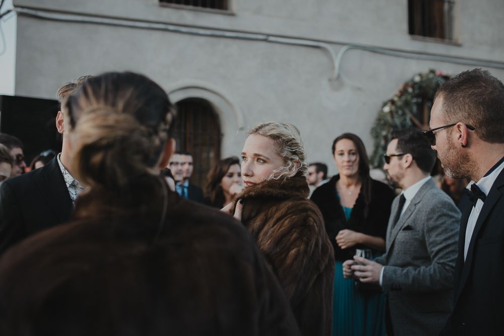 Wedding guests mingling during an outdoor cocktail reception.