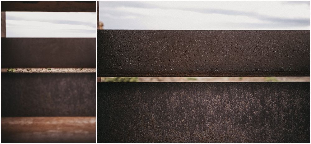 Abstract architectural detail showing dark metal panels with horizontal lines.