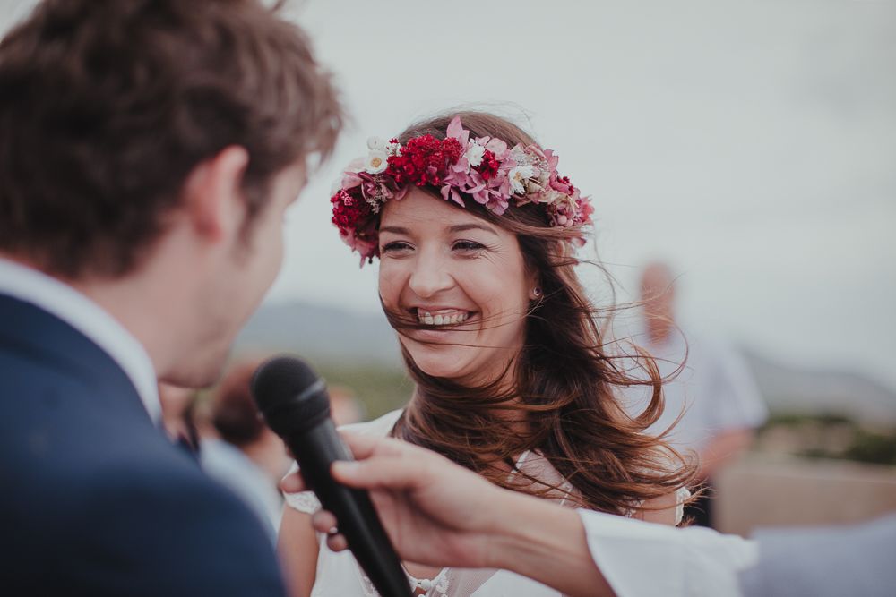 A joyful moment captured during an outdoor rooftop wedding ceremony.