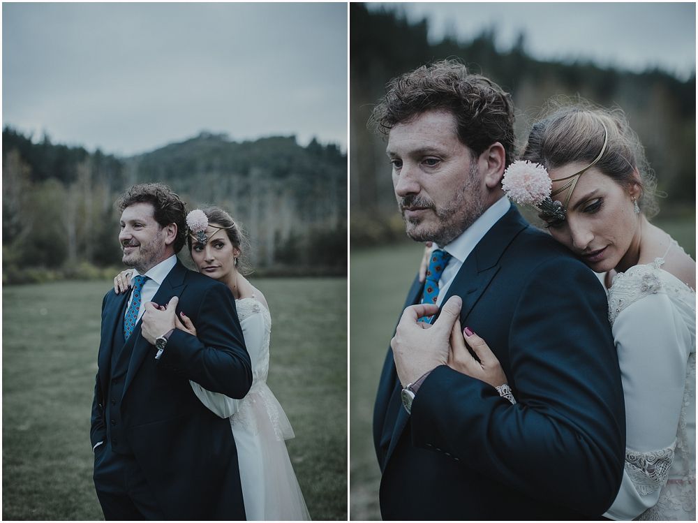 Artistic wedding portraits captured in a moody mountain setting with dramatic lighting.