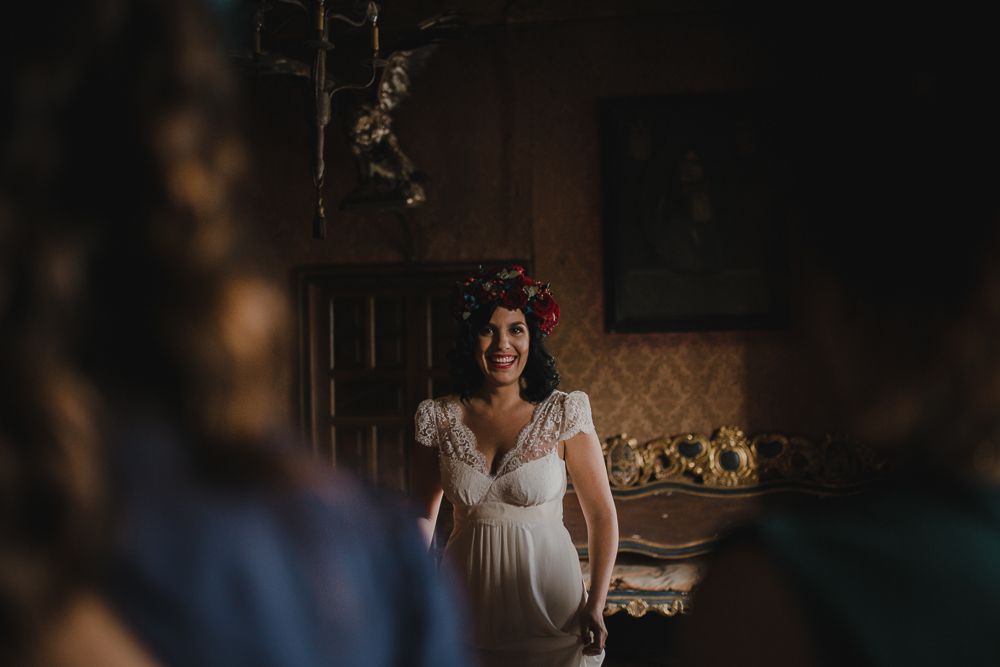 Atmospheric wedding preparation photo in a room with vintage wallpaper and furniture.