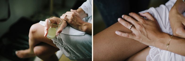Close-up details of hands and wedding dress fabric.
