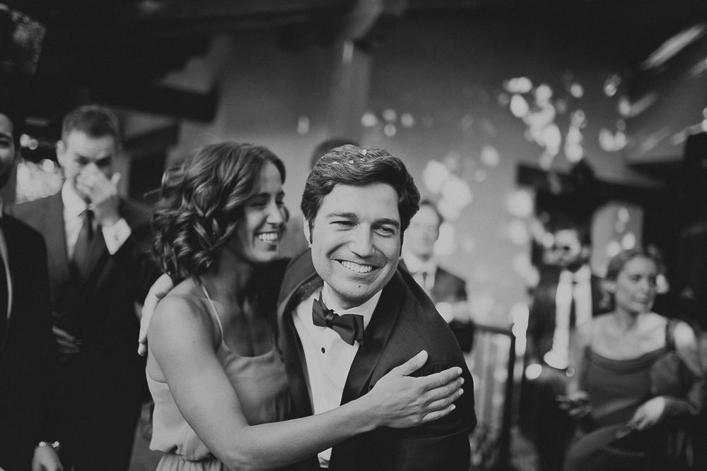Intimate dance moment captured during wedding reception in black and white.