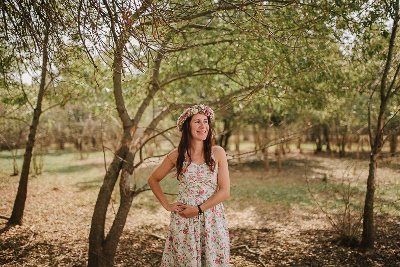 Summer wedding photoshoot in a sun-dappled wooded area.