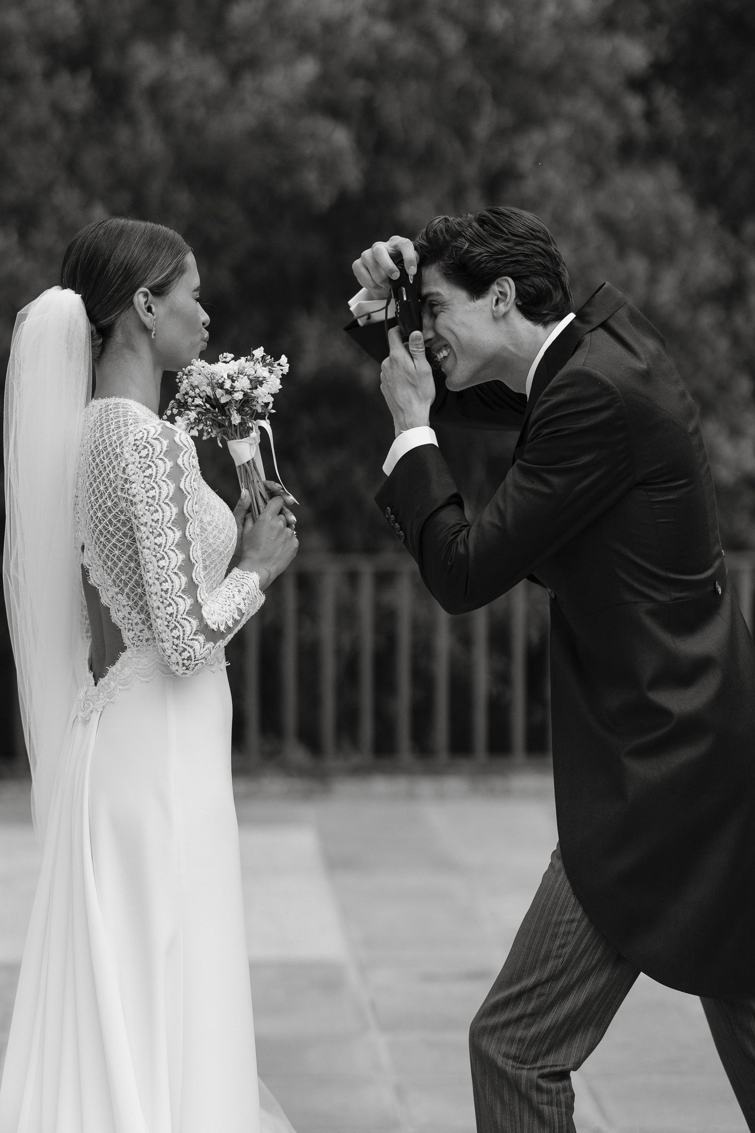 Artistic black and white sequence of a playful wedding photo shoot.