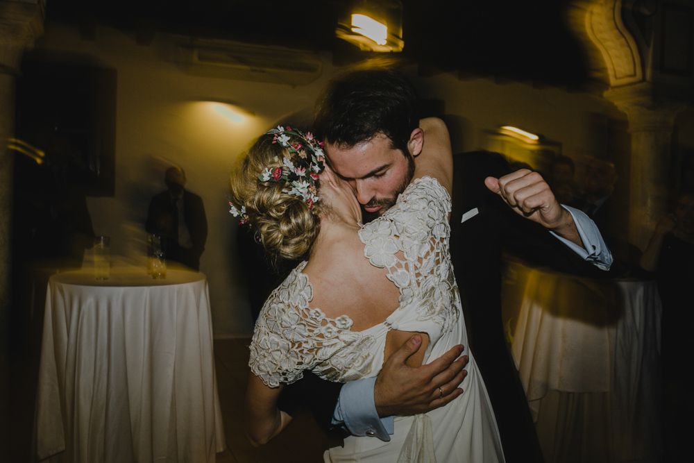 A romantic dance moment captured at an indoor wedding reception.