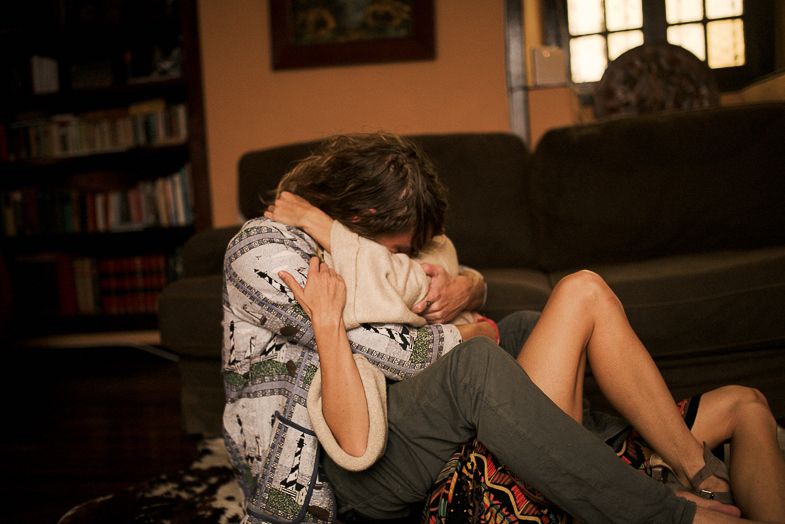 Casual indoor photography session with soft natural lighting from nearby windows.