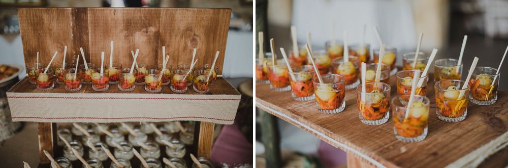 Appetizers and finger foods elegantly displayed on wooden serving trays.